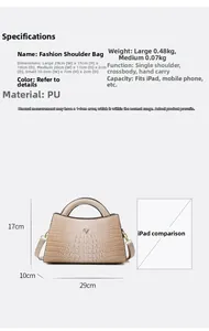Detail view of large beige crocodile pattern tote bag with 29x17x10cm size and V-shaped logo