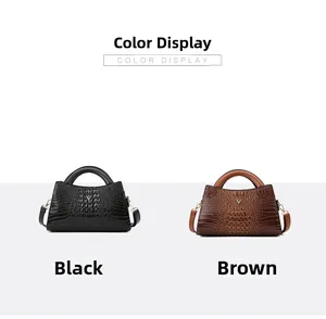 Detail view of crocodile pattern handbags in black and brown with metal V-shaped accents