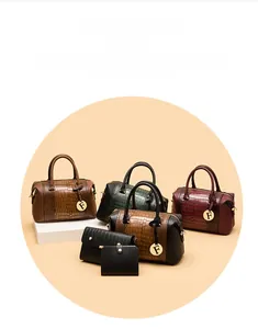 Detail of crocodile embossed leather bags with decorative gold F charms in various colors