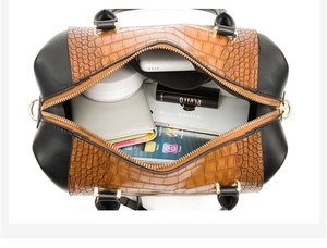 Top view of embossed Boston bag interior showing spacious capacity for daily items