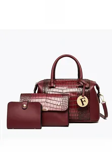 Three-piece set of wine red embossed faux-crocodile leather handbags with gold F charm