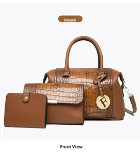 Detailed view of brown embossed leather tote set with gold-tone hardware and F pendant