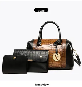 Detailed set of three crocodile embossed bags including tote, clutch and wallet in black