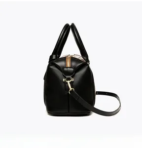 Side view of Boston bag with embossed pattern, dual handles, and golden hardware