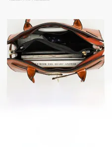 Internal view of embossed leather tote showing spacious compartments and storage capacity