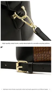 Close-up of golden metal hooks and adjustable shoulder strap on a leather handbag