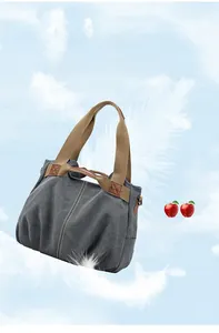 Close-up of lightweight canvas tote with durable brown handles and leather reinforcement