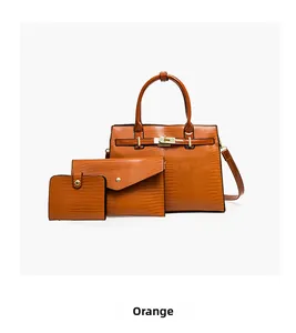 Detailed set of orange embossed faux lizard tote bags with golden hardware and locks