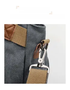 Detail of durable silver matte hardware and leather trim on a canvas tote bag