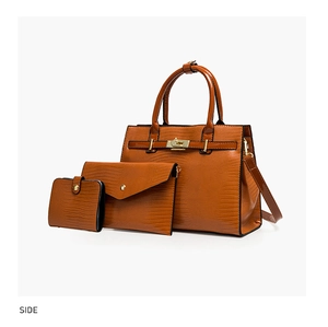 Detail view of red brown lizard embossed tote, clutch and wallet set with gold hardware