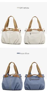 Flat lay showing off-white and hazy blue canvas tote bags with leather-reinforced handles