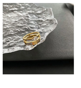 Detail of 18K gold-plated zircon ring with Love Forever engraving and pavé set crystals