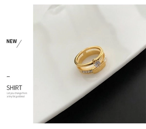 Detail of gold double-layer zircon ring with Love Forever Est 1991 engraving