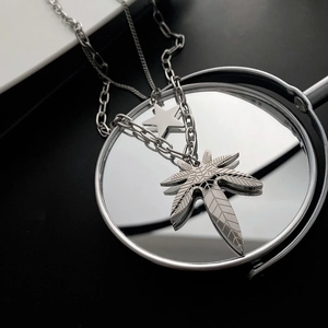 Double-layered titanium steel necklace with star and maple leaf pendant for unisex fashion