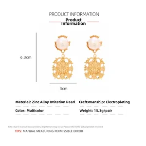 Detailed view of vintage lion head earrings with pearls measuring 6.3cm by 3.0cm