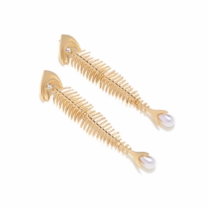 Detail of vintage gold fishbone earrings with sparkling rhinestone eyes and pearl drops