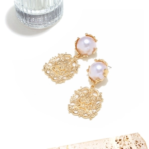 Baroque hollow lion earrings with purple pearls on elegant beige stone base