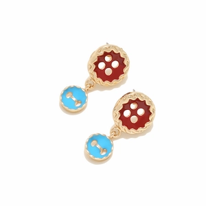Macro view of colorful double layer button earrings with red and blue enamel finish