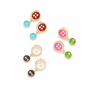 Close-up of double button earrings set in red, blue, pink and white enamel colors