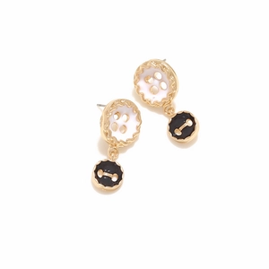 Detail view of retro double-layer button earrings with black and white drip oil finish