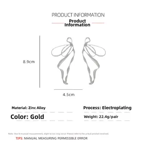 Detail of silver abstract cutout butterfly earrings showing dimensions and zinc alloy texture