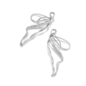 Elegant silver ribbon bow dangle earrings with polished metallic fluid wave design