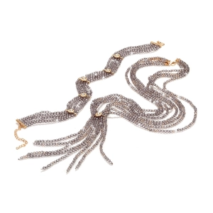 Macro view of multi-strand beaded necklace with gray faceted beads and gold accents