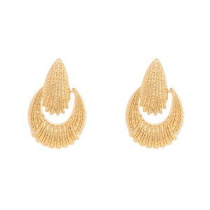 Detailed view of golden earrings with embossed sunburst texture and crescent shape