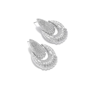 Irregular hollow geometric earrings in silver finish with vertical textured metal pattern