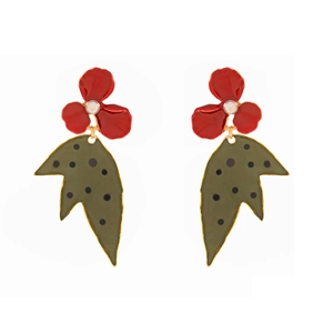 Macro detail of red enamel floral earrings with pearls and green polka dot leaf charms