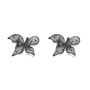 Detailed close-up of handmade black lace butterfly earrings with gold beads and mesh texture