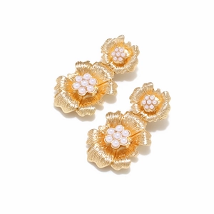 Elegant gold double flower drop earrings with white faux pearl centers in a vintage style