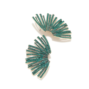 Close-up of fan-shaped fan earrings with vintage gold finish and green rhinestones