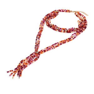 Detailed view of bohemian multilayered beaded necklace with colorful beads and tassel
