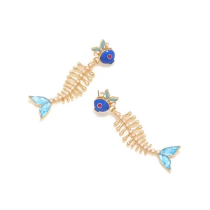 Detailed view of fishbone earrings featuring blue enamel head and small white pearls