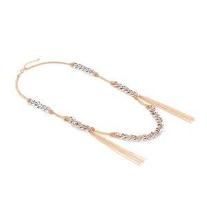 Close-up of mixed gold and silver tassels with woven curb chain details on necklace