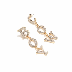 Western retro gold dangling earrings with rhinestones forming the word COWBOY