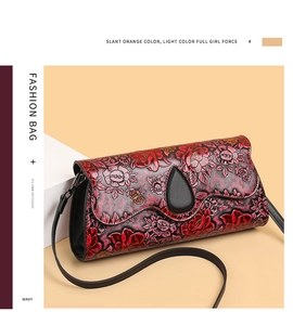 Detail of floral embossed leather and wavy edge design on a vintage shoulder bag