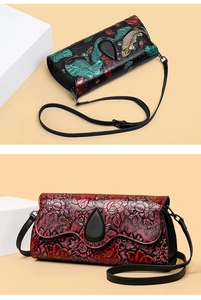 Detail of embossed leather bags featuring koi fish and floral patterns in black and red