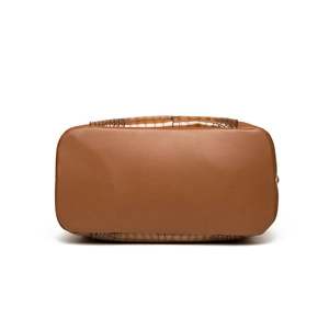 Bottom view of large brown leather shoulder bag with dark embossed crocodile texture detail