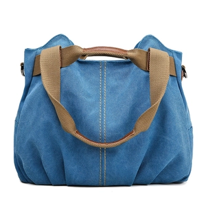 Blue canvas tote bag with wide khaki handles and large capacity casual style