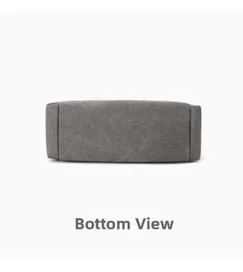 Détail de la base rectangulaire et des coutures renforcées d'un sac en toile grise