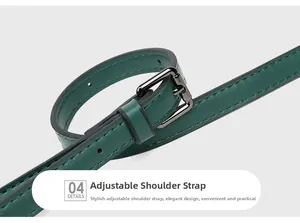 Detail of adjustable dark green leather shoulder strap with metallic buckle and stitching