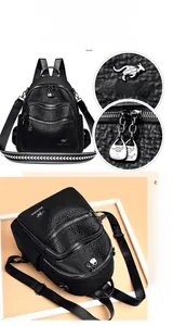 Detail view of black pebble leather backpack featuring silver hardware and a kangaroo logo