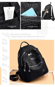 Detail of black pebbled leather backpack showing side pocket and lettered shoulder strap