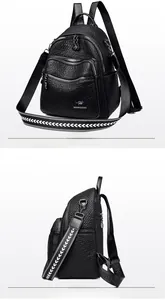 Close-up of black pebble leather backpack featuring kangaroo logo and arrow pattern strap