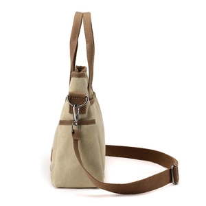 Sac fourre-tout minimaliste en toile kaki avec bandoulière réglable et anses brunes