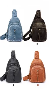 Detail view of retro PU leather crossbody bags in lake blue, black, and caramel colors