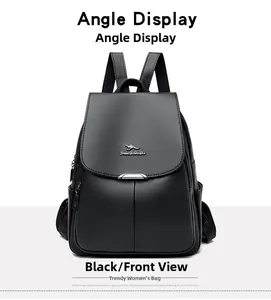 Close-up of black leather backpack featuring kangaroo metal logo and buckles