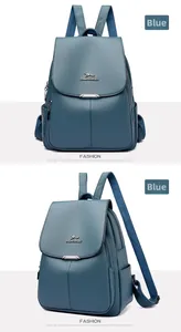 Detail of blue litchi pattern leather backpack with metal kangaroo logo and flap design